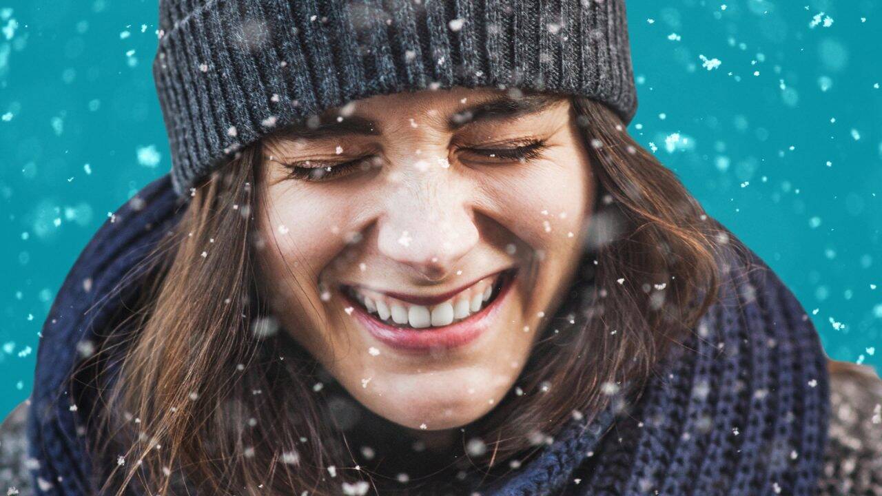 A woman getting snowed on